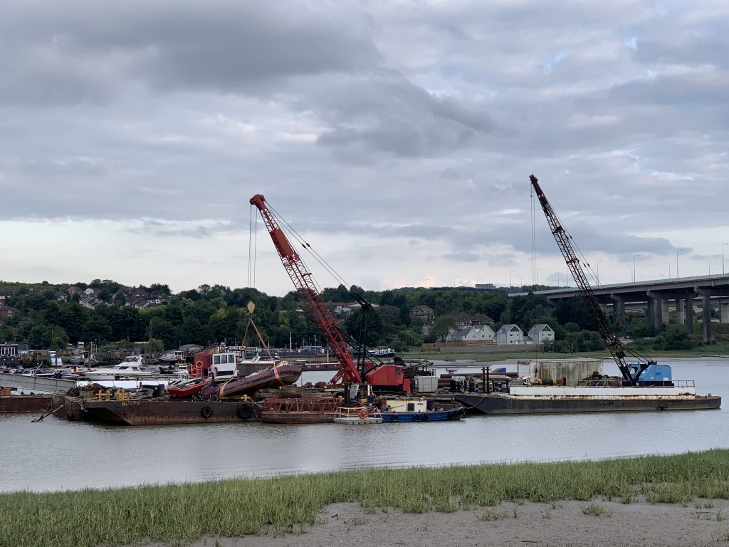 Boat Held By Crane On A Boat