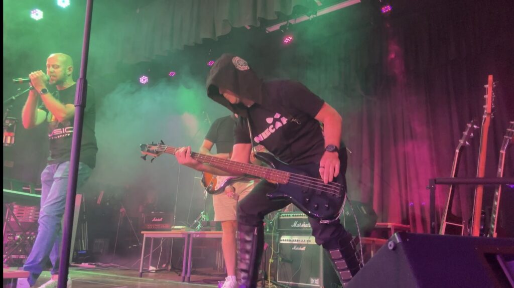 A more atmospheric photo of some bassist